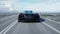 Black futuristic electric car on highway in desert. Very fast driving. Concept of future. Loopable. footage. Realistic