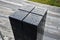 Black gabbro stone prism. it stands in the park and is bevelled and polished. if it gets wet, you can play various sound melodies