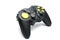 Black game controller with yellow buttons.