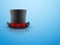 Black gentleman hat cylinder and red ribbon.