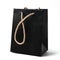 Black gift bag with golden strap isolated