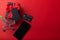 Black gift and red ribbon with black tag, Black credit card and smartphone for shopping on  on red color background. 11.11 single`