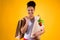 Black girl holding groceries bags isolated.