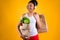 Black girl holding groceries bags isolated.