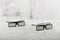 Black glasses on concrete background. Two pairs of 3d glasses on a gray concrete background. Top view, copy space. Two pairs of 3d