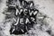 A black glitter on the white background.  Words new year painted on the black sand