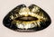 Black and gold lips close up