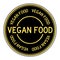 Black and gold round sticker in word vegan food on white background