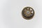 Black and golden ornamented button with floral mandala pattern on the front side. Selective focus