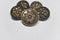 Black and golden ornamented buttons with floral mandala pattern on the front side. Selective focus