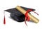 Black graduate hat and paper scroll tied with red ribbon with a bow