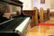 Black grand piano in a church