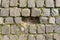 Black gray basalt lava rectangular pavement cobblestones in square format texture. Basalt lava paving stones textures missing ston
