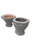 Black gray granite mortar and 2 brick colored terracotta mortars with white background. Used to break down food to make it resolut