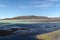 Black and green contrasting water at remote HÃ¡lslÃ³n lake in Iceland with small black sand banks