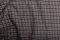 Black and grey checkboard pattern cotton fabric background, garment texture