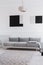 Black and grey geometric paintings on white wall