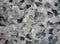 Black and grey haphazard random design on solid sheet of wallpaper. Concept of home decor and interior designing