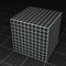 Black grid paper cube on black grid paper floor