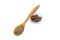 Black ground pepper in wooden spoon and allspice in bowl