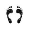 Black grunge barefoot footprint isolated on white background. Vector design element.