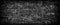 Black grunge brick wall panoramic background.