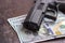 Black gun on American dollars background. Military industry, war, global arms trade, weapon sale, contract killing