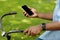 Black guy holding smartphone with blank screen using navigation app