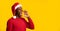 Black Guy In Santa Hat Shouting At Copy Space, Making Christmas Announcement