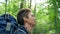 Black-haired man enjoys life uniting with nature closeup