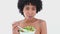 Black haired woman eating salad