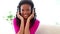 Black haired woman listening to music