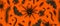 Black Halloween creepy crawly bugs and spider on orange background