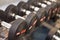 Black hand weights in a gym, close-up