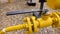 Black handle on the yellow pipe
