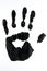 Black handprint on a white background. Black and white photo.