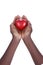 Black hands holding a red heart