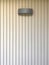 Black hanging lamp on stripe cement wall