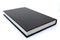 Black hard back book lying flat and closed with white background