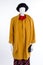 Black hat and yellow coat on mannequin.