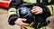 Black helmet in fireman's hand close-up