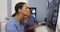 Black and hispanic female doctors working together with cell phone and computers