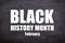 Black history month and February white text in black background.