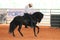 Black horse and rider at the rodeo