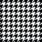 Black houndstooth pattern vector. Classical checkered textile design.