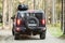 Black Hummer H2 vehicle goes on dirty country road