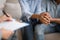 Black Husband And Wife Holding Hands At Marital Psychologist`s Office