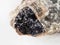 black Ilmenite close up in raw Nepheline close up