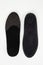 Black Insoles isolated on a white background. Medical orthopedic insoles. Foot care. Insole cutaway layers. Treatment