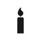 Black isolated icon of candle on white background. Silhouette of light. Flat design.